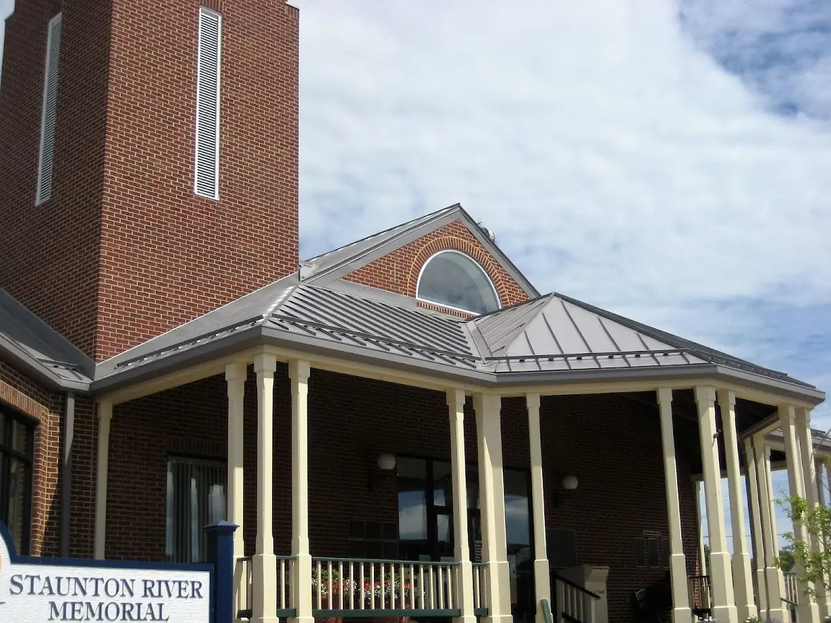 Skilled roofing craftsmen working on a residential roof in West Allenhurst